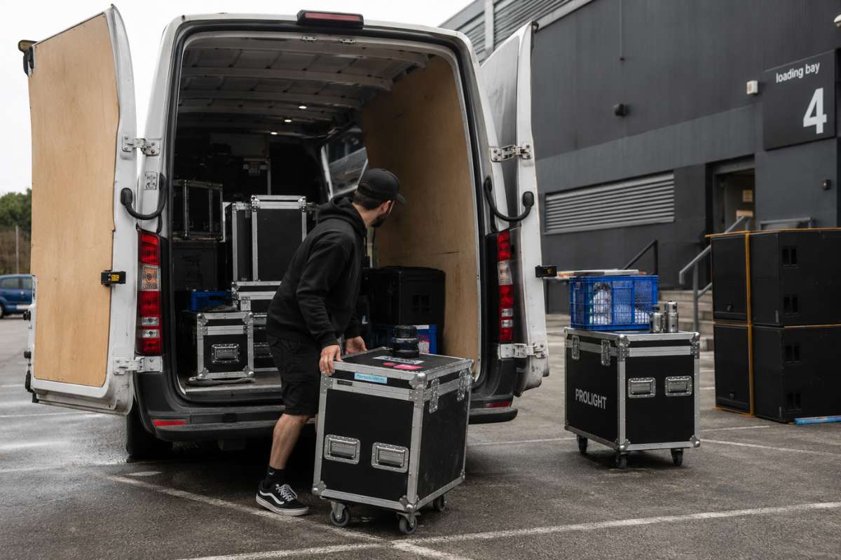 Event materials being unloaded from a van at a conference venue