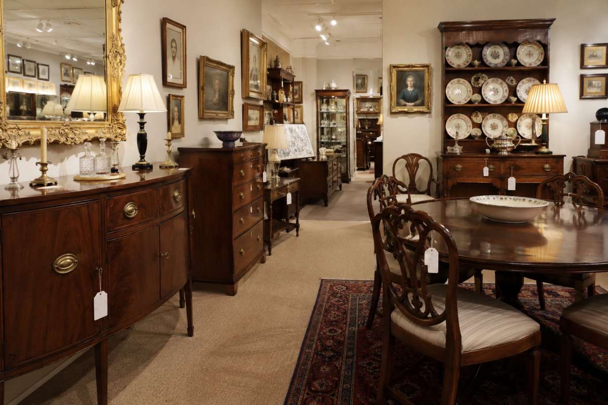 Antique furniture displayed in a dealer's showroom